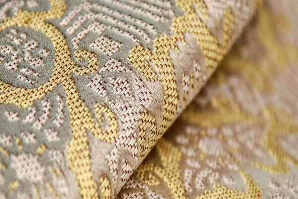 Examining the intricate patterns and designs in brocade fabrics