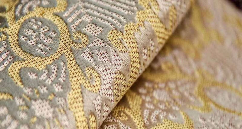 Examining the intricate patterns and designs in brocade fabrics
