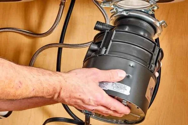 Reset Button Leaks: Top Causes in Garbage Disposals