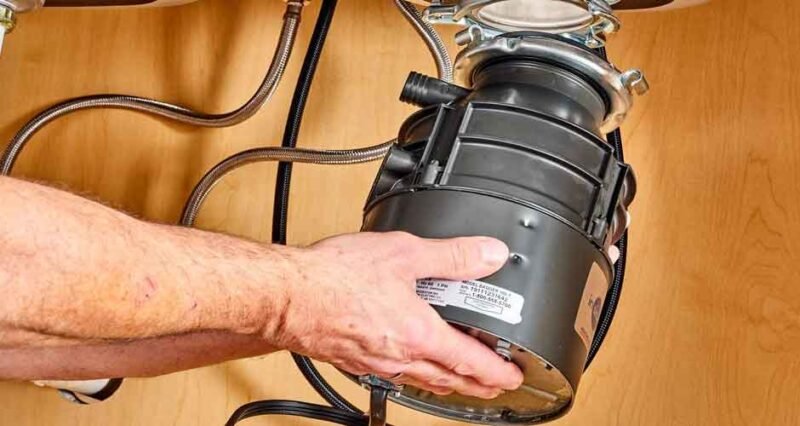 Reset Button Leaks: Top Causes in Garbage Disposals
